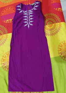 Dark Purple Shiny A Line Kurti Of Size-xs/'s' available...Length Is Just Below The Knee.....Apair Of Sleeves With An Extra Button Available Inside It