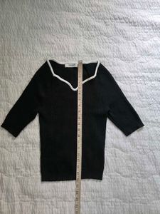 Stylish Black Ribbed Top with White Trim