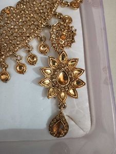 necklace, earing and 1 mang tika