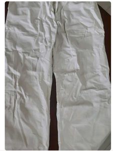 Off-white formal trousers for men.