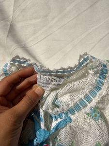 White Floral Blouse with Blue Ribbon