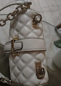 Beige sling bag along with chain slin