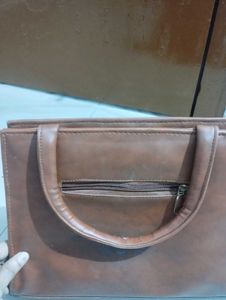 Chic Brown Handbag with Embellished Handle