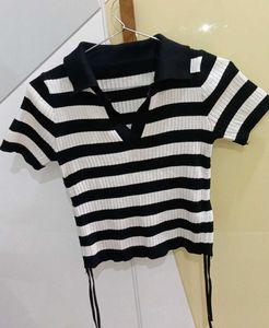 a black and white striped streetwear top. basic we