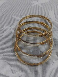 Elegant Gold Tone Bangles with Pearl Accents