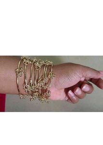Set of Golden Kashmiri Bangles with Charms