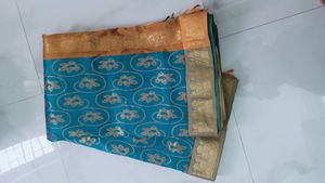 Elegant Teal Saree with Gold Motif