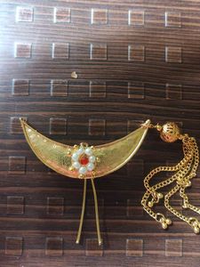 Gold-toned hair broach