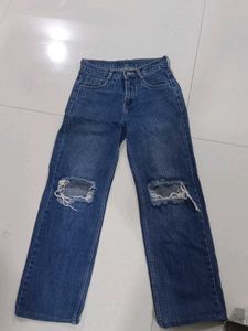 Ripped Knee Blue Jeans
