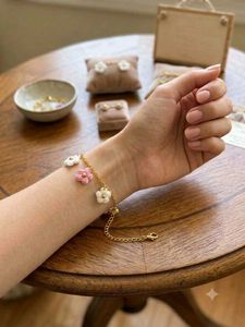 crochet flower bracelet with golden chain