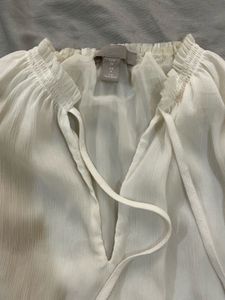 Elegant White Sleeveless Tie-Neck Top