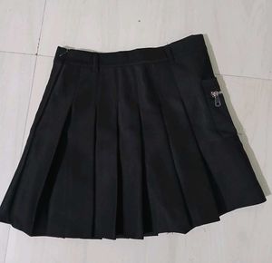 Classic black pleated mini skirt.
