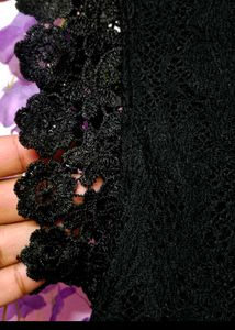 Elegant Black Lace Dress with Red Floral Detail