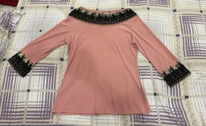 Elegant Pink Top with Black Lace Trim