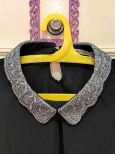 Chic Black Top with Embellished Collar
