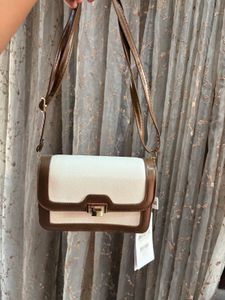 Savana sling purse