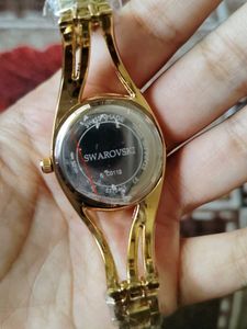 Elegant Gold Watch with Green Dial
