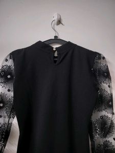 Elegant Black Dress with Sheer Embellished Sleeves