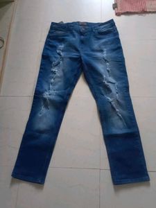 Stylish Men's Ripped Blue Jeans branded with tag