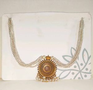Elegant Pearl Necklace with Sun Pendant