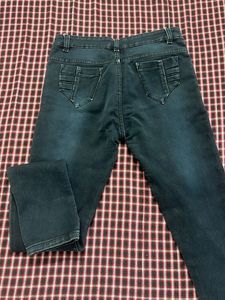 Dark Wash Ripped Jeans with Embellished Pockets