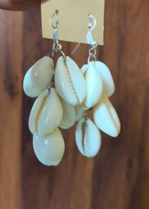 Peacock feather oxidised earrings and shell cowrie