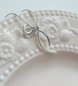 Silver Bow Pendant Necklace
