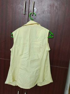 Yellow sleeveless shirt for women