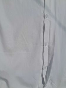 White balloon-sleeve shirt.