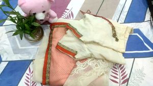 cream nd light orange saree with  Embroid