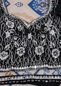 Selling a black color partywear stitched saree