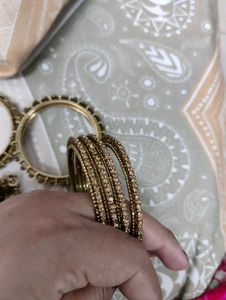 Set of Elegant Gold Bangles with Stones
