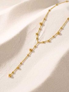 Elegant Gold Beaded Lariat Necklace