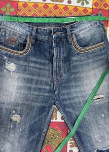Distressed Blue Denim Jeans