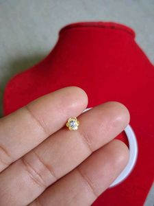 Gold Flower Nose Pin as earpressing