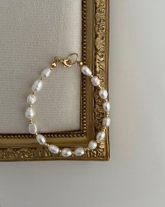 Delicate Pearl Necklace with Gold Accent