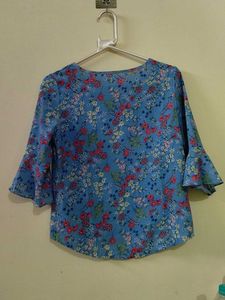 Blue floral ditsy- print top. (Material: Not sure)