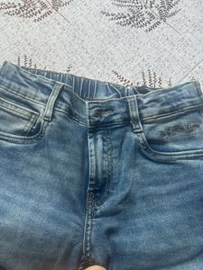 Distressed Blue Denim Jeans