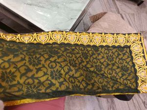 Elegant Yellow Saree with Intricate Border