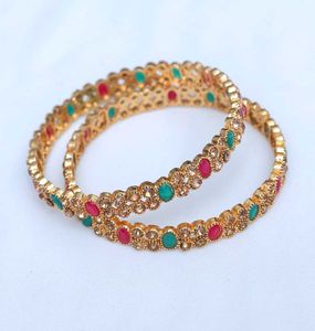 Elegant Gold Bangles with Gemstones