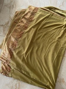 Elegant Golden Saree with Paisley Border