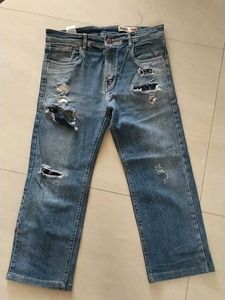 Distressed Blue Denim Jeans
