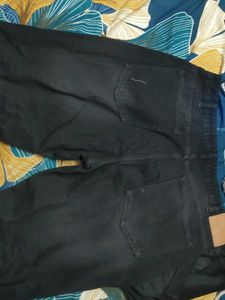 Black Distressed bootcut Jeans with hem