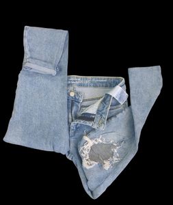 Skinny Fitting Torn Jeans