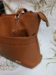 "Carry your essentials in style with this Handbag"