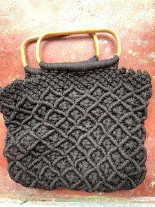 Handmade cord handbag in wooden handle