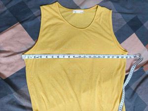 Yellow Sleeveless Top with Ruffle Hem