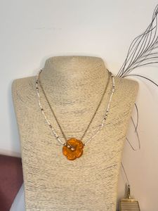 beaded gold and pearl beads with flower pendant