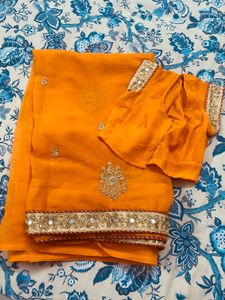 Exquisite Orange Saree with Embellishments
