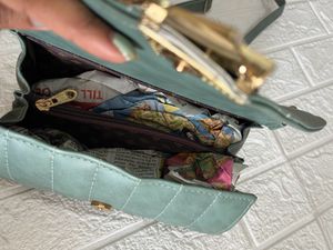 Green Roll shaped sling bag